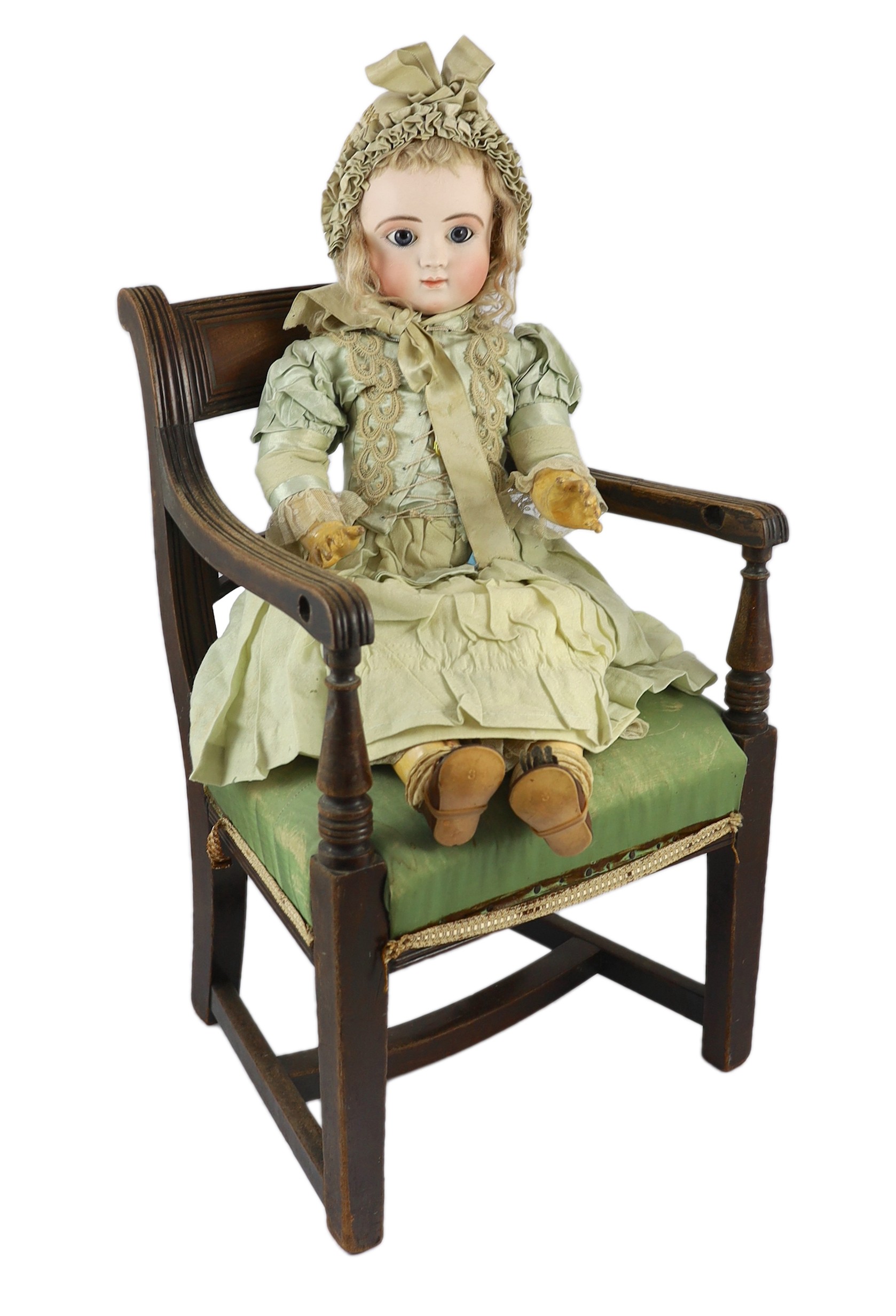 A Jules Steiner Bourgoin bisque doll, French, circa 1880, 24in. Please note the chair is for display purposes only.